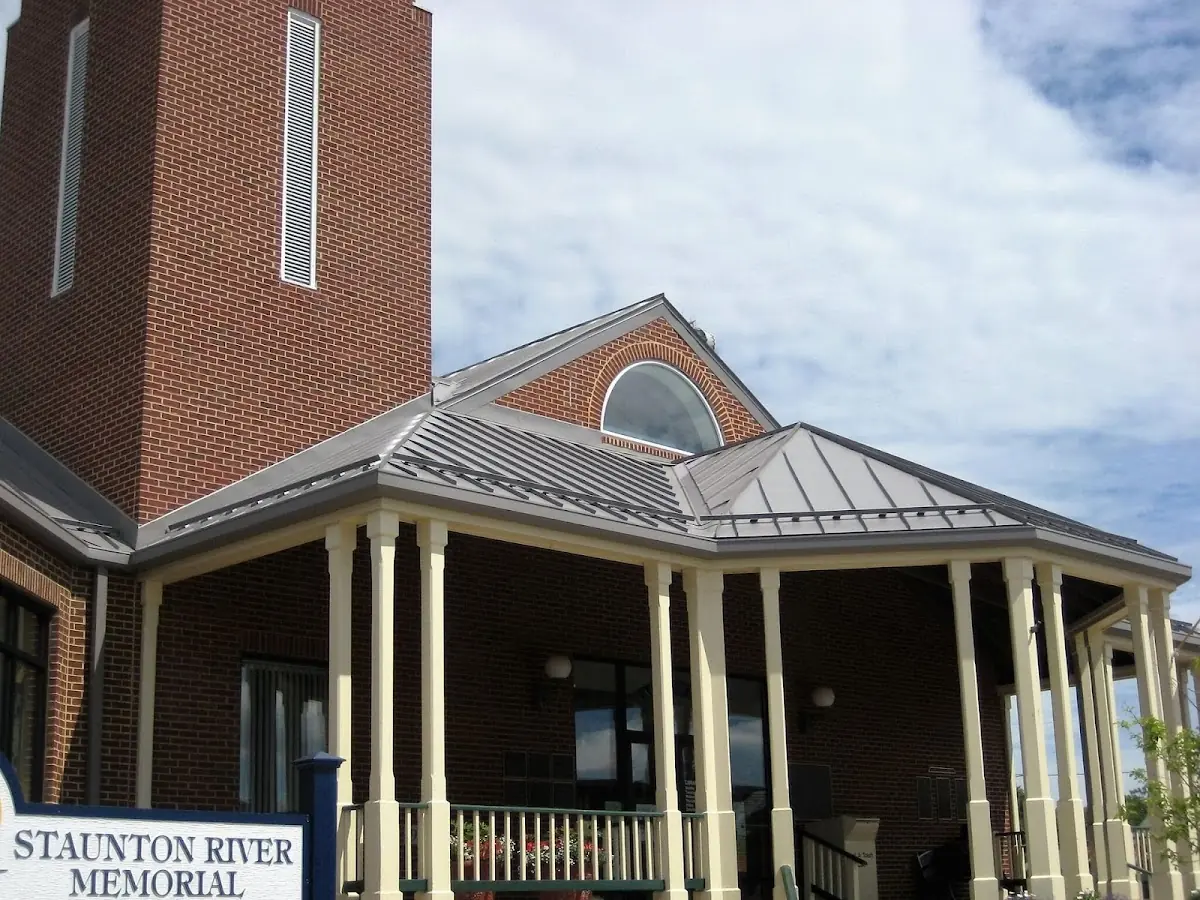 Skilled roofing craftsmen working on a residential roof in Storrs